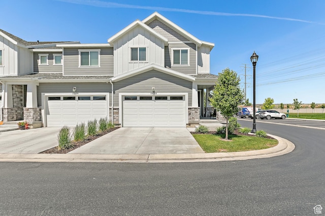 15022 S Halter Way W, Bluffdale, UT 84065 - view of front of home with board and batten siding, stone siding, an attached garage, and concrete driveway