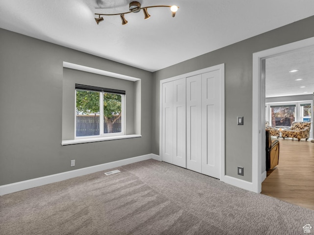 10685 S Superior Cir E, Sandy, UT 84094 - unfurnished bedroom featuring baseboards, a closet, and recessed lighting