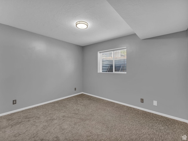 10685 S Superior Cir E, Sandy, UT 84094 - empty room featuring carpet flooring, baseboards, and a textured ceiling
