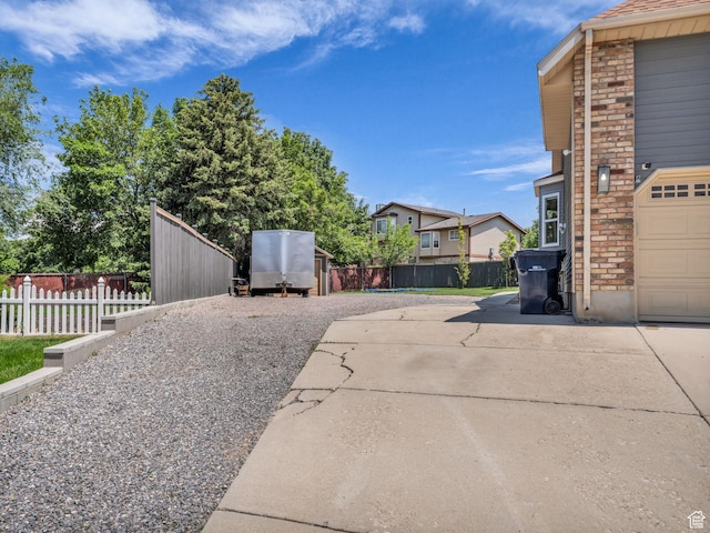 10685 S Superior Cir E, Sandy, UT 84094 - view of patio with driveway and a residential view