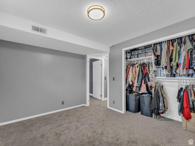 10685 S Superior Cir E, Sandy, UT 84094 - unfurnished bedroom featuring carpet floors, baseboards, a textured ceiling, and a closet