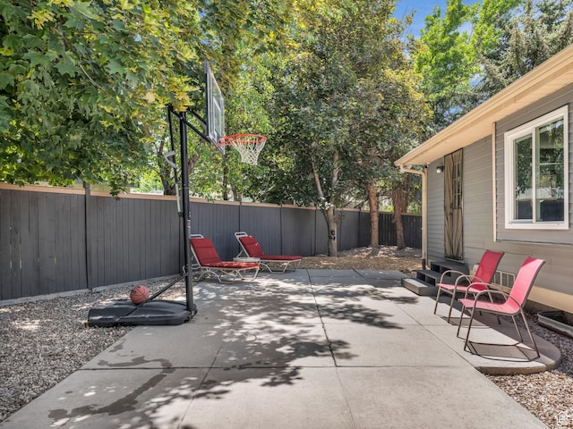 10685 S Superior Cir E, Sandy, UT 84094 - fenced backyard featuring a patio area and entry steps