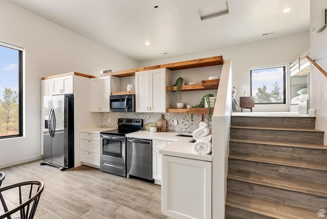 2836 S 2300th Cir E, St George, UT 84790 - kitchen featuring stainless steel appliances, open shelves, tasteful backsplash, plenty of natural light, and recessed lighting