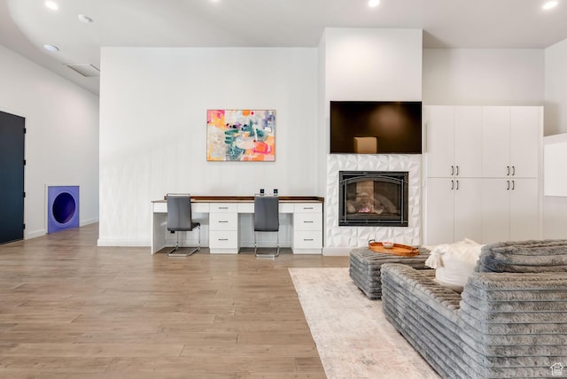 2836 S 2300th Cir E, St George, UT 84790 - living area featuring light wood-style flooring, recessed lighting, baseboards, and a glass covered fireplace