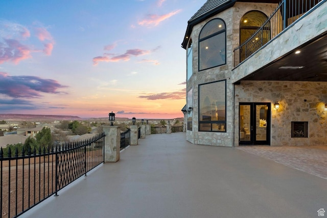 2836 S 2300th Cir E, St George, UT 84790 - patio terrace at dusk with a patio, a balcony, and french doors