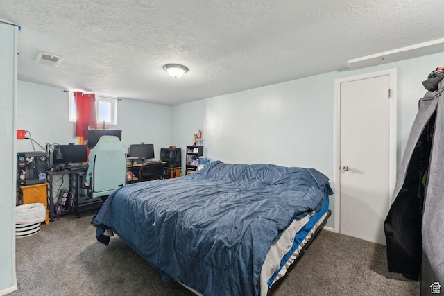 717 9th St, Ogden, UT 84404 - bedroom with carpet floors and a textured ceiling