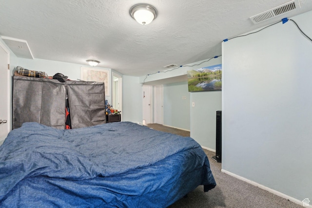 717 9th St, Ogden, UT 84404 - bedroom featuring baseboards, a textured ceiling, and carpet floors