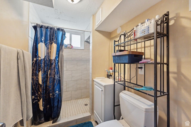717 9th St, Ogden, UT 84404 - full bathroom with toilet, a tile shower, and vanity