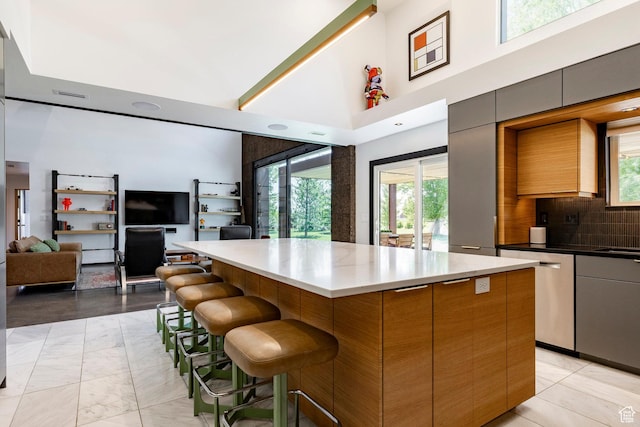 1983 W Ranch Rd, Farmington, UT 84025 - kitchen featuring a high ceiling, stainless steel dishwasher, a center island, open floor plan, and modern cabinets