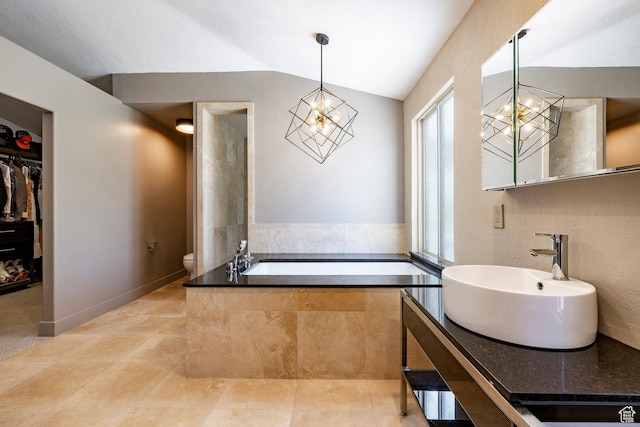 1983 W Ranch Rd, Farmington, UT 84025 - bathroom featuring a chandelier, toilet, vaulted ceiling, a bath, and vanity