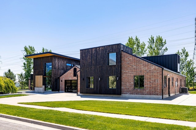1983 W Ranch Rd, Farmington, UT 84025 - view of building exterior featuring concrete driveway and central AC