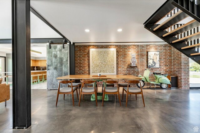 1983 W Ranch Rd, Farmington, UT 84025 - dining room featuring finished concrete floors, brick wall, and recessed lighting