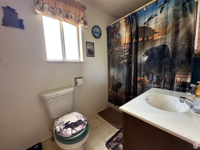 50 N 100 E, Meadow, UT 84644 - bathroom with vanity, baseboards, toilet, and tile patterned floors