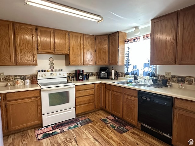 50 N 100 E, Meadow, UT 84644 - kitchen featuring white electric range, black dishwasher, a sink, and light wood finished floors