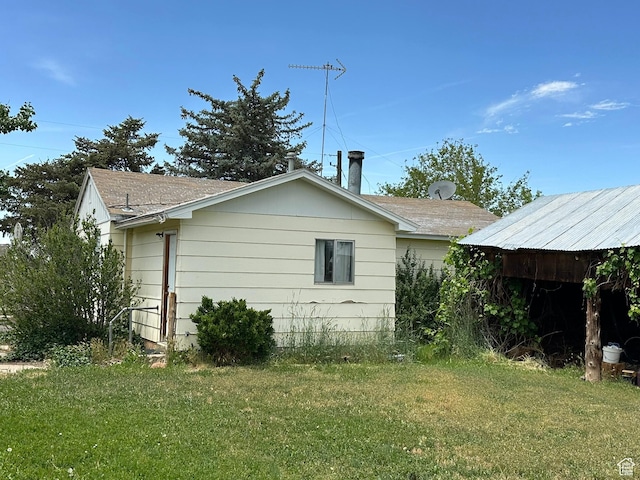50 N 100 E, Meadow, UT 84644 - view of home's exterior featuring a yard and a shingled roof