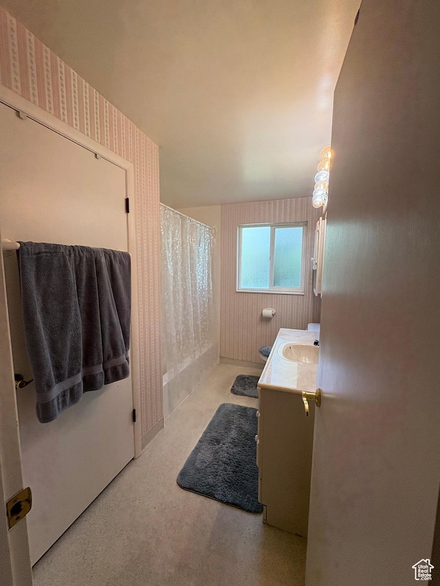 9835 S 610 E, Sandy, UT 84070 - bathroom with vanity, wallpapered walls, and a shower with shower curtain