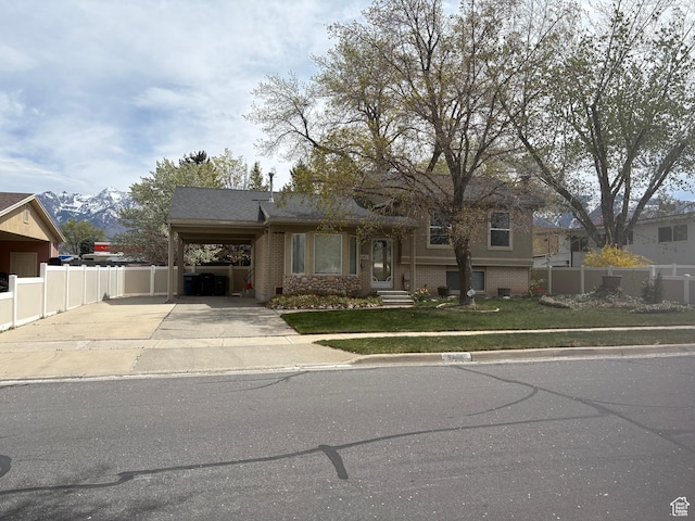 9835 S 610 E, Sandy, UT 84070 - split level home with driveway, brick siding, and an attached carport