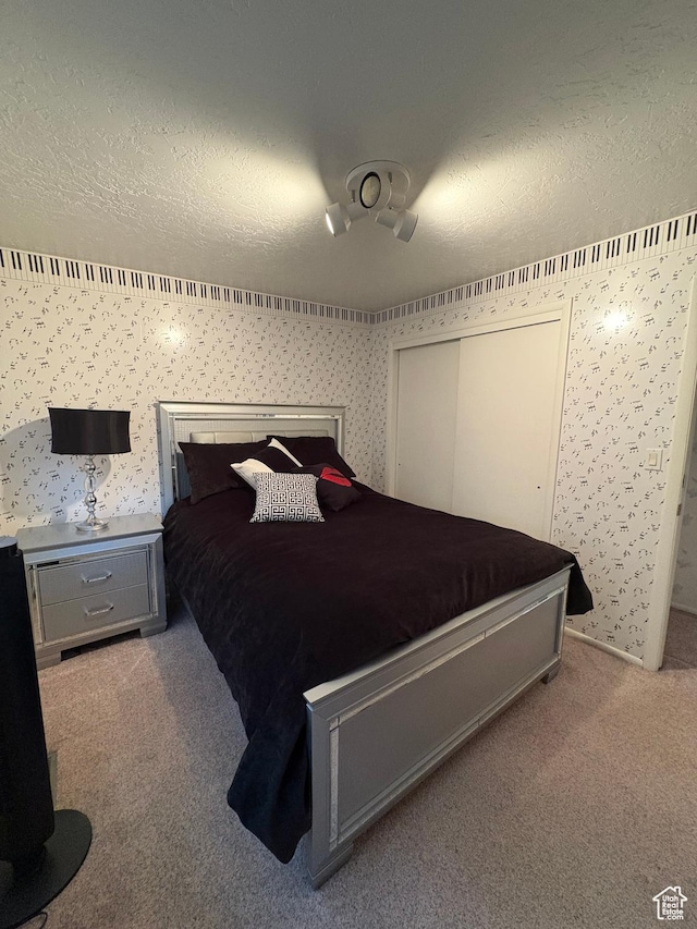 9835 S 610 E, Sandy, UT 84070 - carpeted bedroom with a textured ceiling