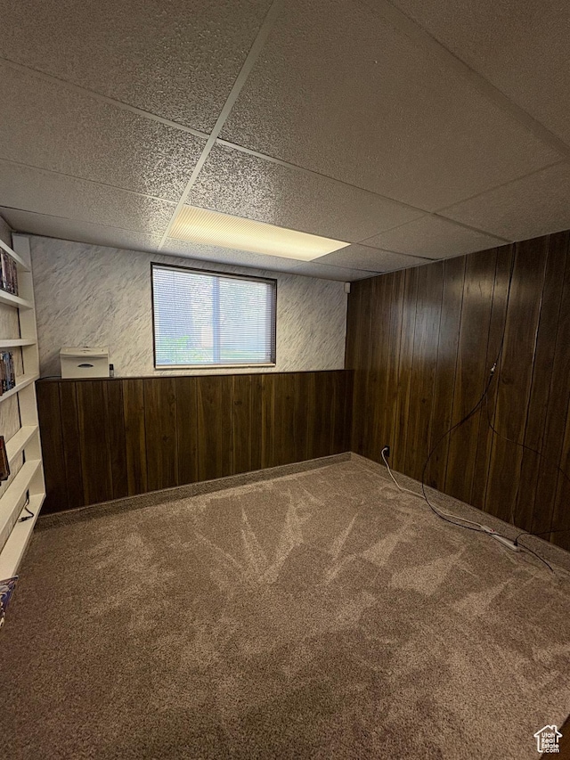 9835 S 610 E, Sandy, UT 84070 - below grade area with wood walls, a paneled ceiling, and carpet floors