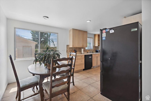 175 Green Dr, Layton, UT 84041 - kitchen with freestanding refrigerator, dishwasher, light brown cabinetry, light countertops, and plenty of natural light