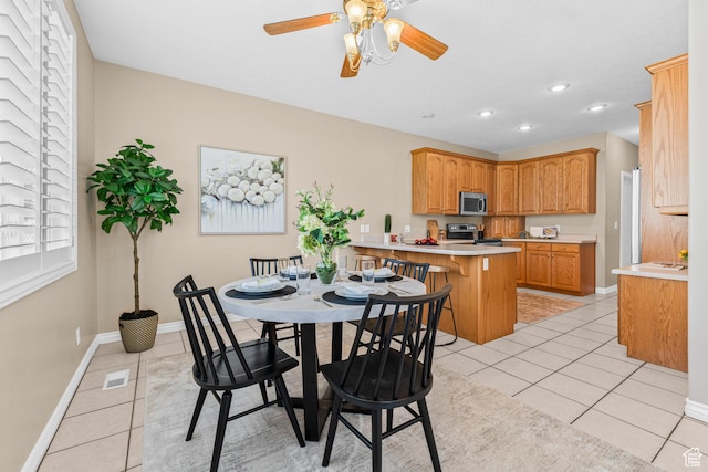 11815 S Cottage Side Way E, Draper, UT 84020 - dining room with light tile patterned floors, baseboards, a ceiling fan, and recessed lighting