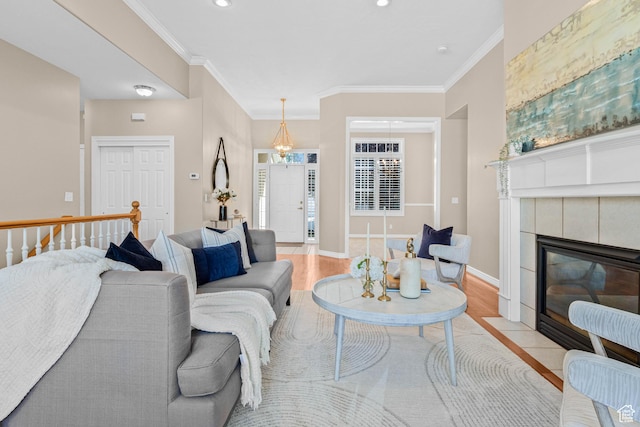 11815 S Cottage Side Way E, Draper, UT 84020 - living area featuring light wood-type flooring, crown molding, a fireplace, baseboards, and recessed lighting