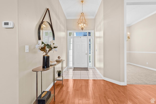 11815 S Cottage Side Way E, Draper, UT 84020 - entrance foyer featuring a chandelier, crown molding, light wood-style floors, and baseboards