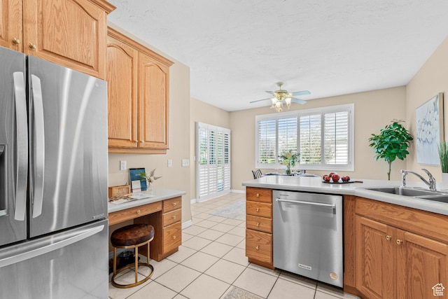11815 S Cottage Side Way E, Draper, UT 84020 - kitchen with stainless steel appliances, light tile patterned floors, light countertops, a ceiling fan, and a sink