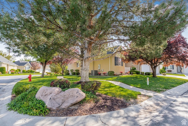 11815 S Cottage Side Way E, Draper, UT 84020 - view of front of home with concrete driveway, a front lawn, an attached garage, and stucco siding