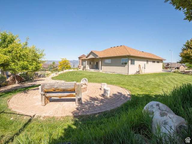 935 S 950 E, Ephraim, UT 84627 - rear view of property with stucco siding, a yard, and a patio