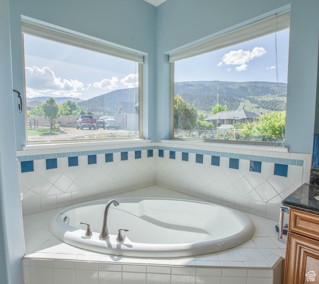 935 S 950 E, Ephraim, UT 84627 - bathroom with vanity, a garden tub, a mountain view, and plenty of natural light