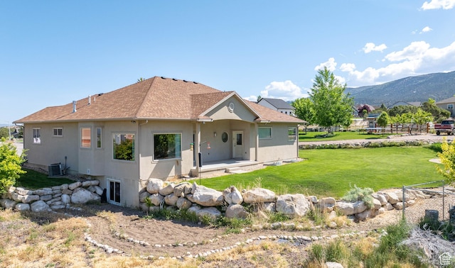 935 S 950 E, Ephraim, UT 84627 - back of house with stucco siding, central air condition unit, a yard, and a patio