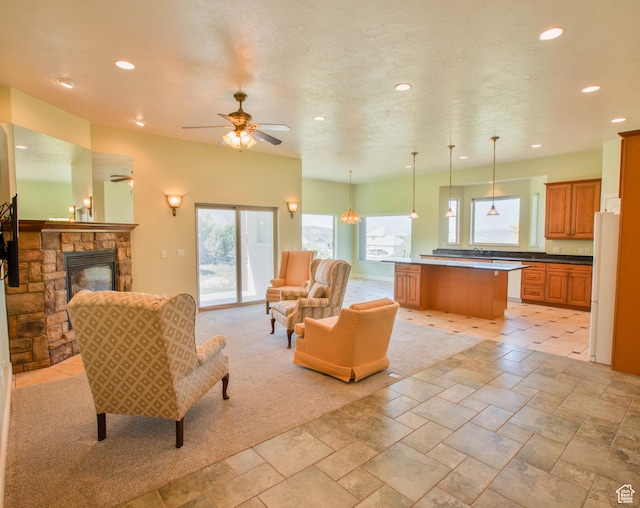 935 S 950 E, Ephraim, UT 84627 - living room featuring recessed lighting, a ceiling fan, a fireplace, and stone tile floors