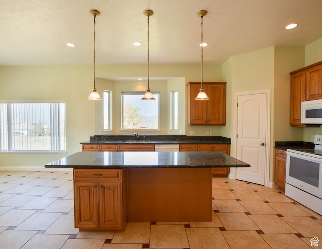 935 S 950 E, Ephraim, UT 84627 - kitchen featuring white appliances, a center island, recessed lighting, brown cabinetry, and hanging light fixtures