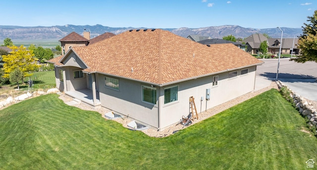 935 S 950 E, Ephraim, UT 84627 - back of property with stucco siding, a shingled roof, and a yard