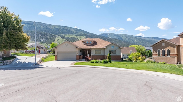 935 S 950 E, Ephraim, UT 84627 - view of front of property with a mountain view, a garage, driveway, and a residential view