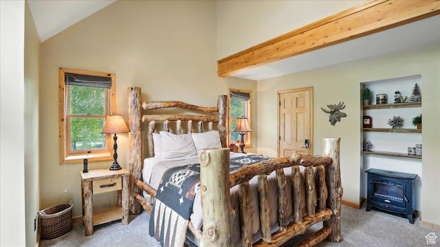3786 Beaver Creek Rd, Kamas, UT 84036 - bedroom featuring carpet flooring, a wood stove, and vaulted ceiling