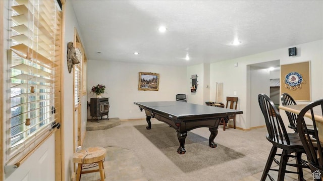 3786 Beaver Creek Rd, Kamas, UT 84036 - playroom with a wood stove, light carpet, recessed lighting, and baseboards