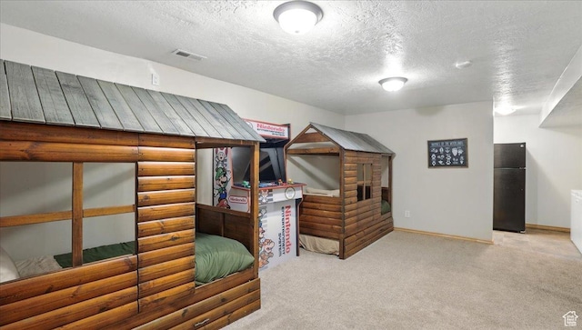 3786 Beaver Creek Rd, Kamas, UT 84036 - bedroom featuring freestanding refrigerator, carpet flooring, a textured ceiling, and baseboards