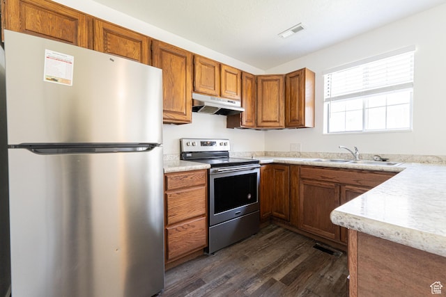 1560 W 300 S # 1, Vernal, UT 84078 - kitchen featuring appliances with stainless steel finishes, under cabinet range hood, dark wood finished floors, and light countertops