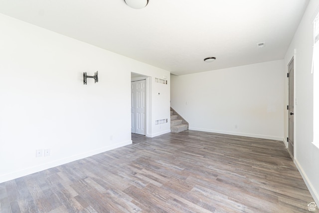 1560 W 300 S # 1, Vernal, UT 84078 - empty room with stairway, wood finished floors, and baseboards