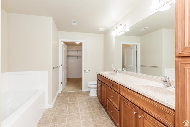344 E 2280 N Unit C, North Logan, UT 84341 - bathroom featuring double vanity, a bath, toilet, tile patterned floors, and a spacious closet