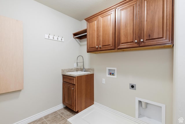 344 E 2280 N Unit C, North Logan, UT 84341 - washroom with electric dryer hookup, cabinet space, hookup for a washing machine, baseboards, and light tile patterned floors