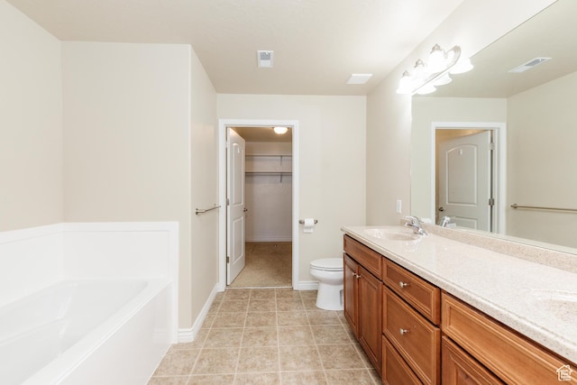 344 E 2280 N Unit C, North Logan, UT 84341 - full bathroom with double vanity, a garden tub, toilet, a spacious closet, and baseboards