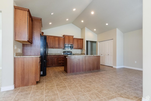 344 E 2280 N Unit C, North Logan, UT 84341 - kitchen with appliances with stainless steel finishes, high vaulted ceiling, an island with sink, light stone counters, and brown cabinets