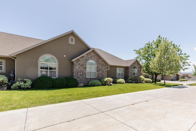 344 E 2280 N Unit C, North Logan, UT 84341 - ranch-style home with a front lawn, stucco siding, and stone siding