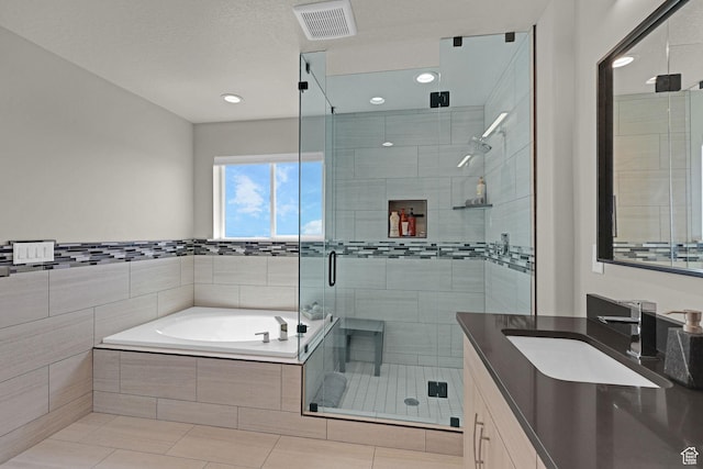 3877 N 425 E, North Ogden, UT 84414 - full bathroom with vanity, a bath, a stall shower, recessed lighting, and tile patterned floors