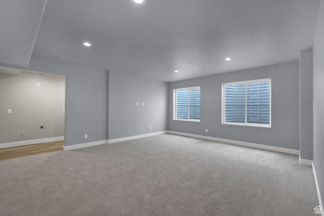3877 N 425 E, North Ogden, UT 84414 - empty room featuring carpet, recessed lighting, baseboards, and a textured ceiling