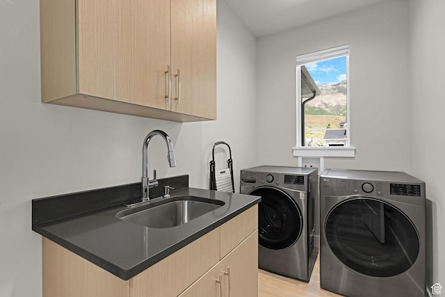 3877 N 425 E, North Ogden, UT 84414 - laundry area featuring separate washer and dryer, cabinet space, and light wood-style flooring