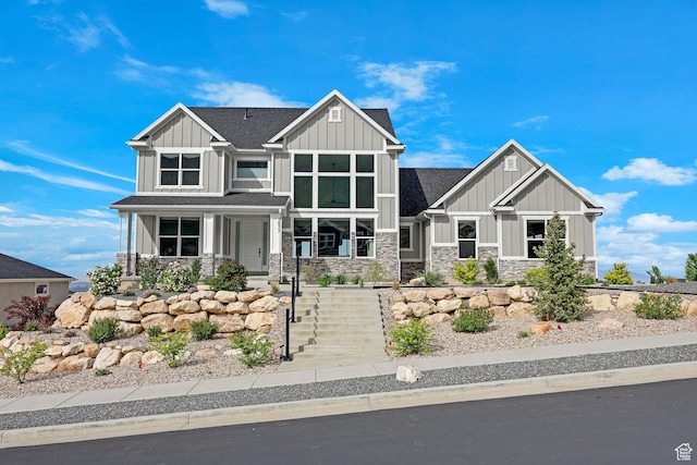 3877 N 425 E, North Ogden, UT 84414 - craftsman-style home with board and batten siding, stone siding, a shingled roof, and a porch